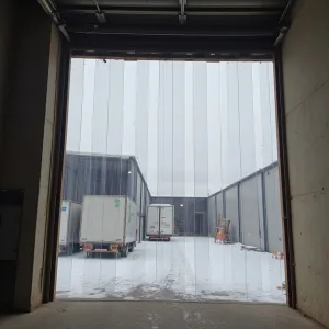 Polar low temperature PVC strip curtain in a cold area with snow used to keep the cold temperature out the doorway