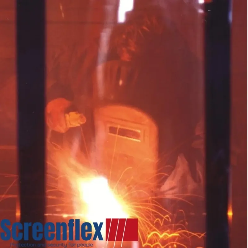 Screenflex PVC strip curtain with a welder seen welding through the PVC strips