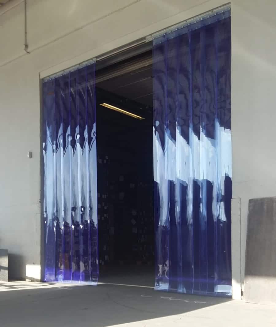 clear PCV strip curtain in a doorway with the centre of the doorway clear