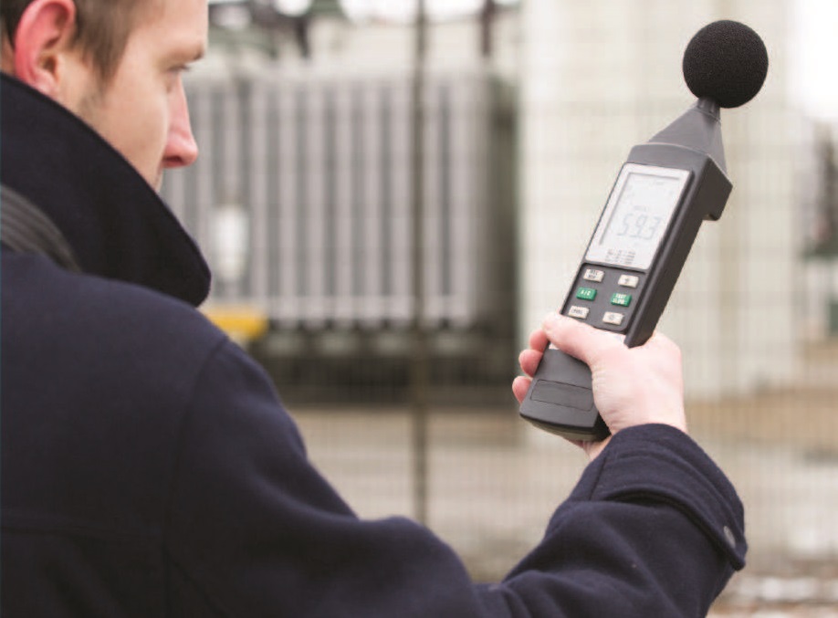 man using the microphone to monitor sound levels