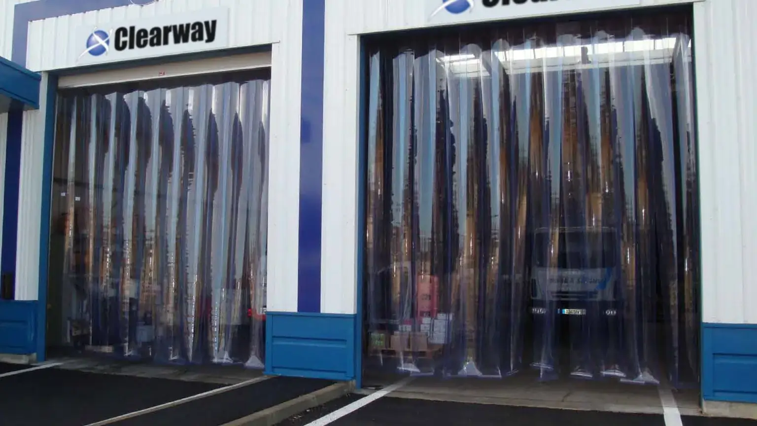 Clearway PVC strip curtains in a factory loading bay for heavy vehicles