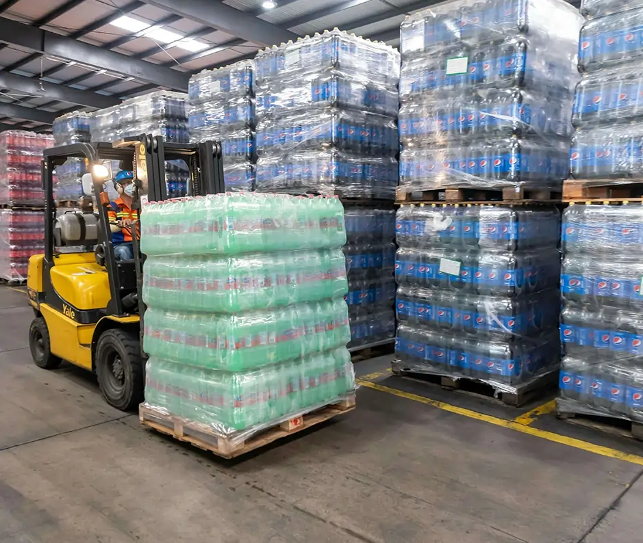 plastic packaging factory with a forklift driver