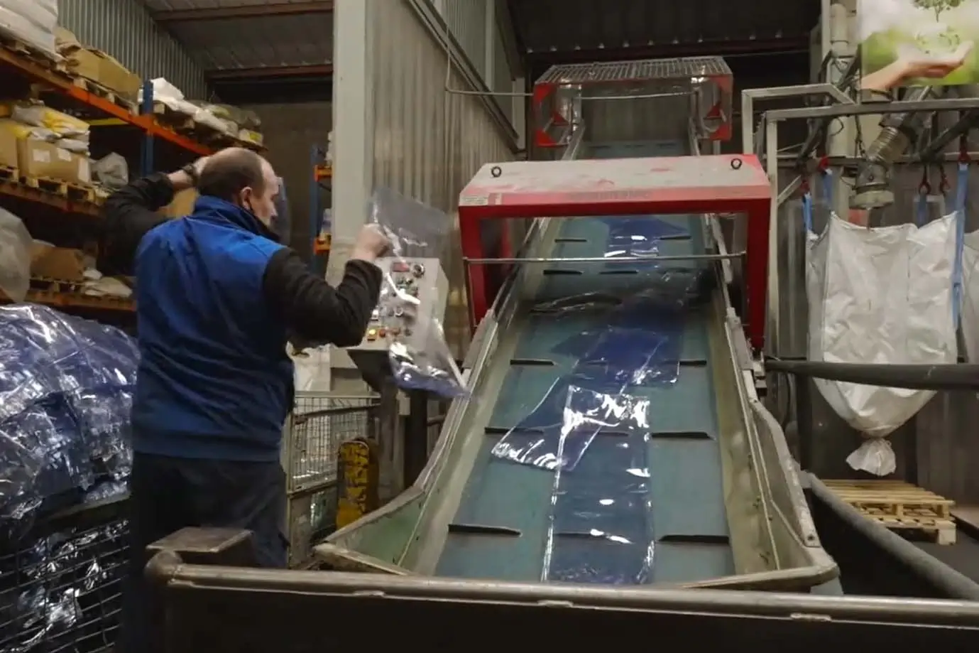 Clearway worker adding the PVC to the convey to be recycled in our recycling centre