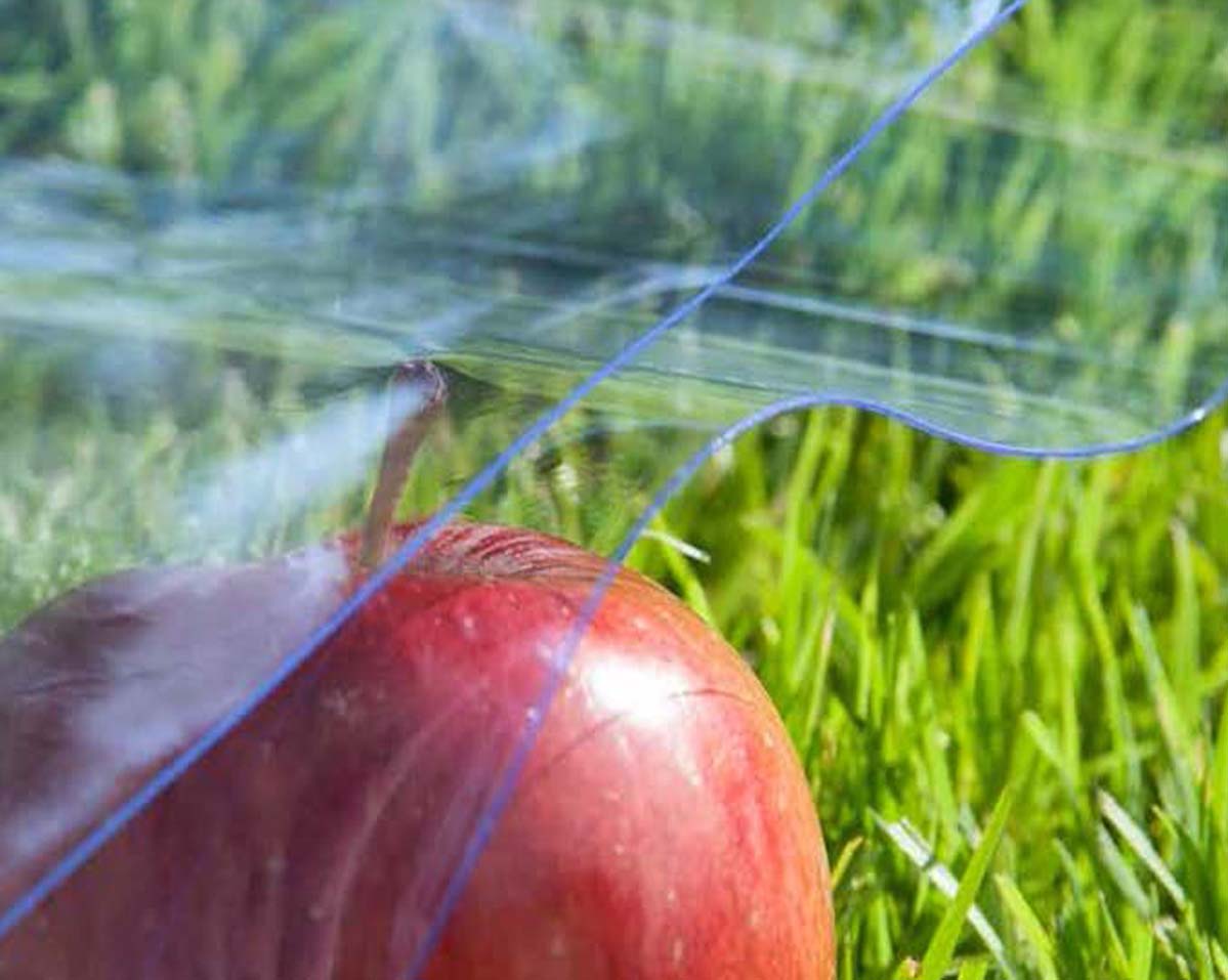 PVC on an apple lying on the grass to show our food safe PVC range