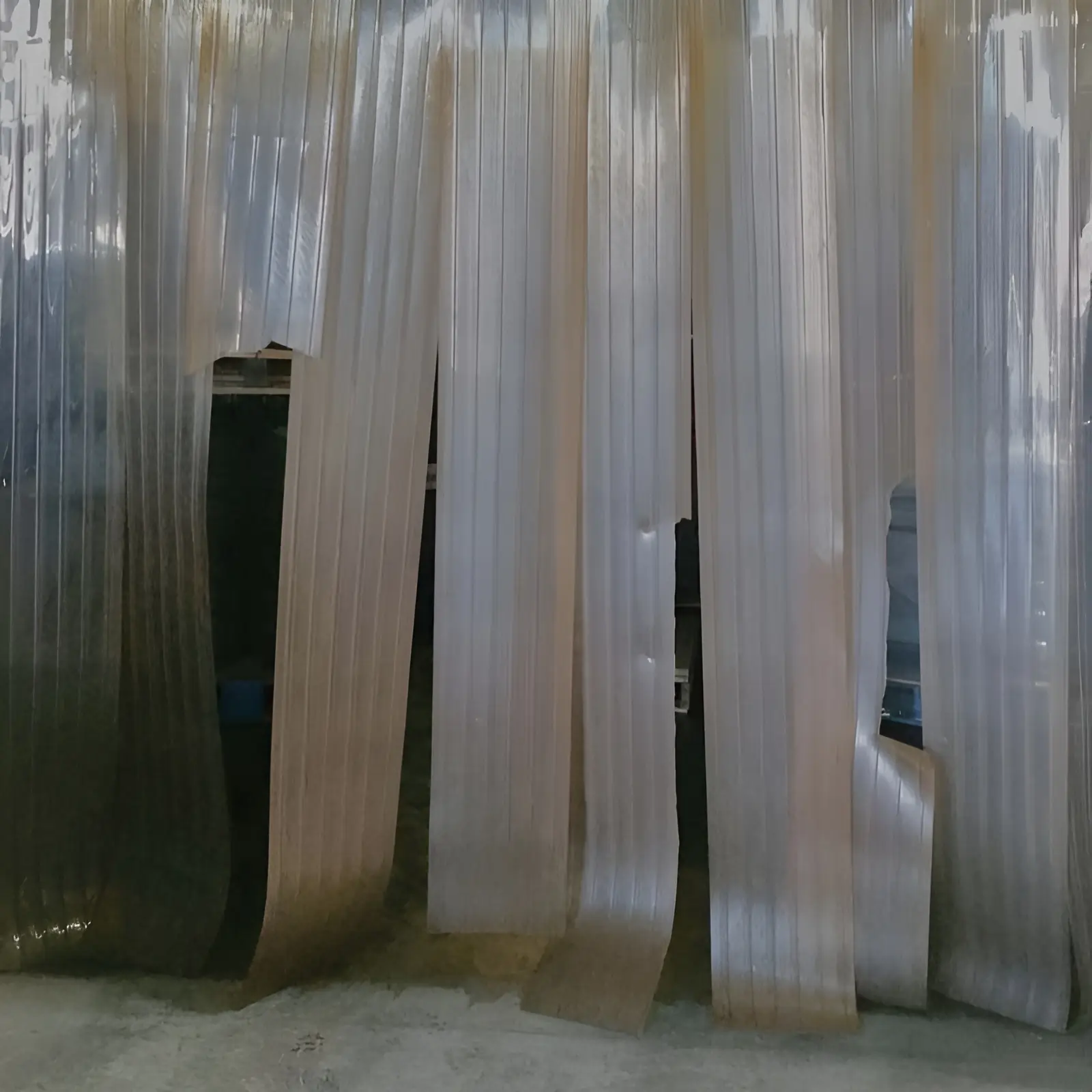 old damaged PVC strip curtains that need replacing