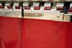 Red transparent PVC Strip Curtain zoomed in on to the plates and hanging rails